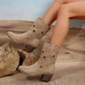 Western cowboy boots with star cut-out detail across the suede shaft and stacked block heel