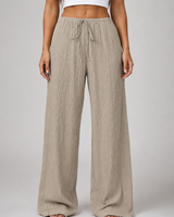 Front view of wide leg crinkle trousers with drawstring waist