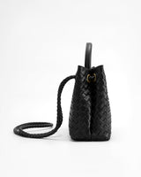 Side view of the woven bag showing the upright silhouette and defined base
