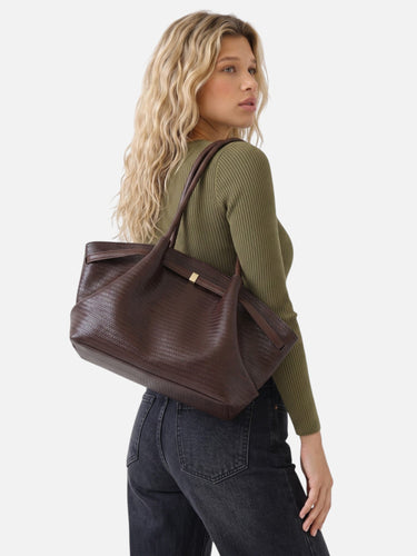 Close-up of the shoulder straps and their connection to the bag body