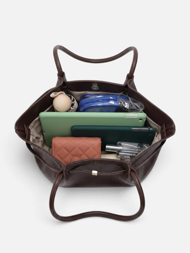 Lifestyle shot of the woven tote bag carried on the shoulder