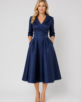 Front view of a wrap front midi dress with pleated A-line skirt and notched lapel collar