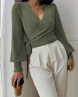 Detail shot of the V-neckline formed by the wrap-front panels