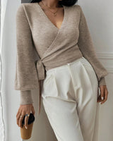 Close-up of the adjustable tie-belt detail at the waist