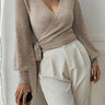 Close-up of the adjustable tie-belt detail at the waist