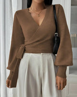 Back view of the wrap sweater in beige