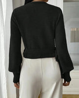 Front view of the wrap sweater in black