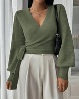 Close-up of the knitted fabric texture on the wrap sweater