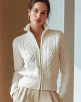 Cropped cable knit cardigan styled with high-waisted trousers, side view